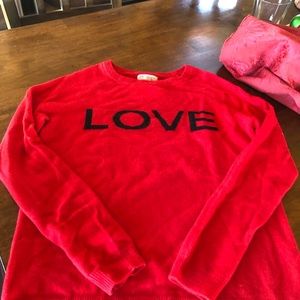 Red cashmere crew neck sweater.   You’ll LOVE it.